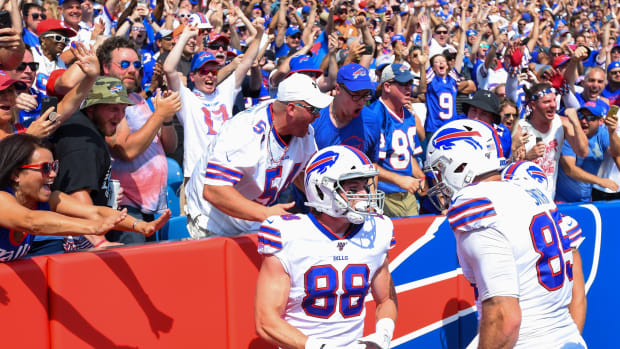 Buffalo Bills tight end Dawson Knox (88) celebrates his touchdown catch with teammate tight end Lee Smith (85) against the Cincinnati Bengals during the first quarter at New Era Field. Mandatory Credit: Rich Barnes-USA TODAY Sports